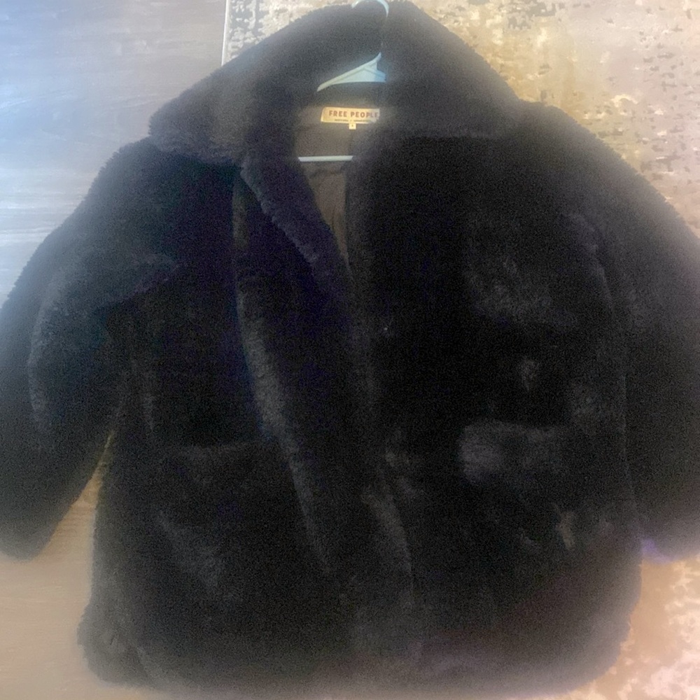 Free People black retro jacket.  Looks awesome with black tall boots.